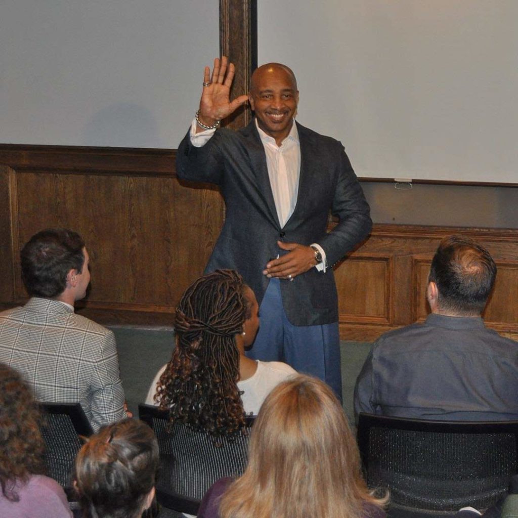 Dr. D Ivan Young waving to audience