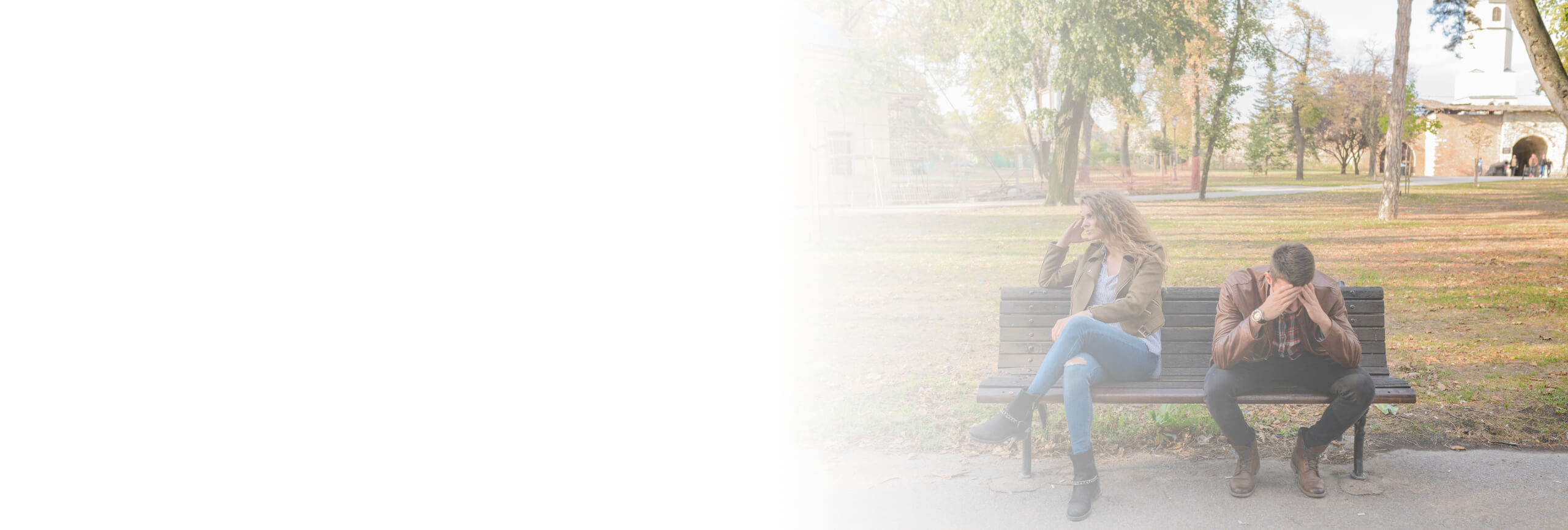 A couple on a bench in the middle of an argument.