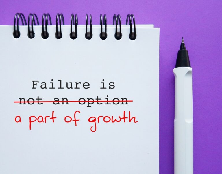 pen and pad with Failure is Part of growth written on it. How Suppressing Emotions Harms the Brain by Dr. D Ivan Young, MCC, NBC-HWC