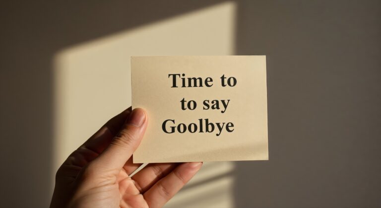 How to Know When It’s Time to Leave a Relationship. Image - hand holding a Post-it note with Time to Say Goodbye on it